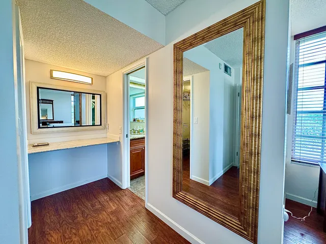 a view of a room that has a large window