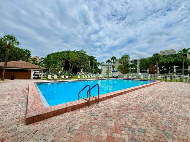 a view of swimming pool with a yard