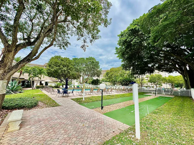 a view of a park with large trees