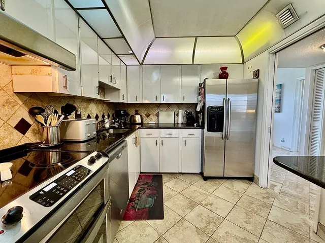 a kitchen with a stove and a refrigerator