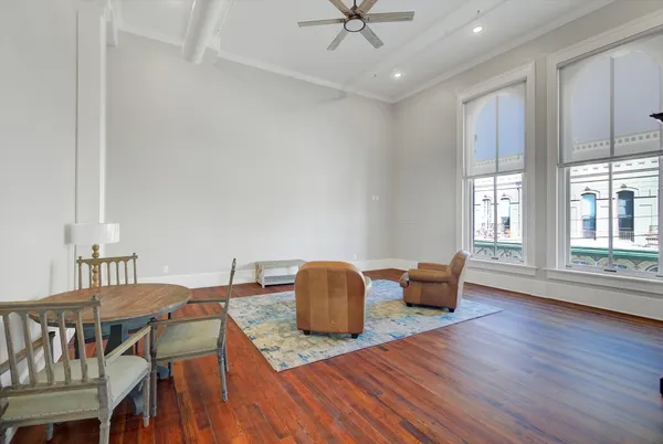 a workspace with furniture window and wooden floor