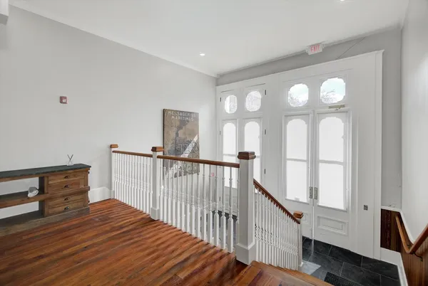 a view of entryway with wooden floor