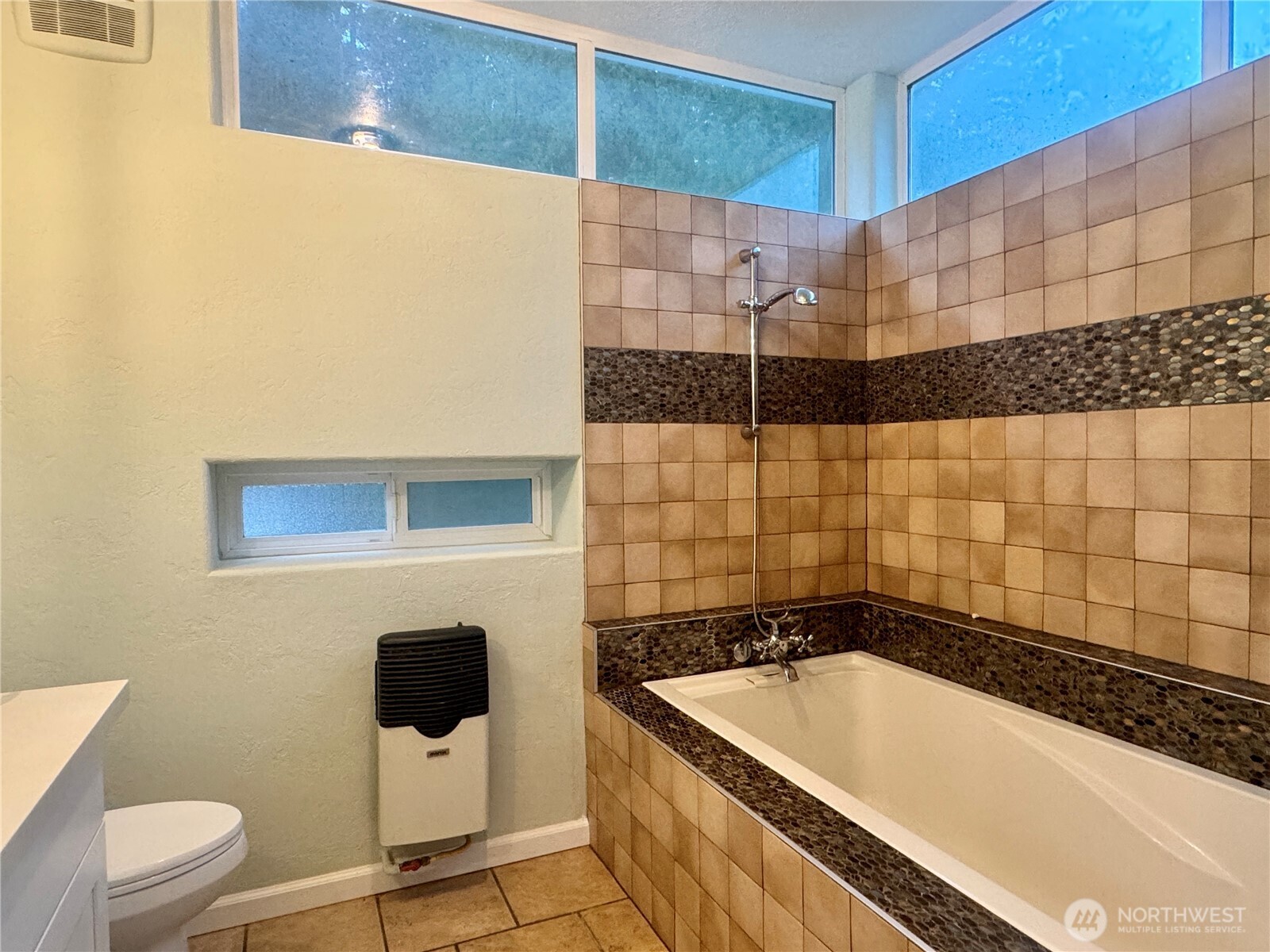 22305 Bald Hill Road Southeast Yelm, WA 98597 - Photo 12 of 39 a bathroom with a bathtub and a shower