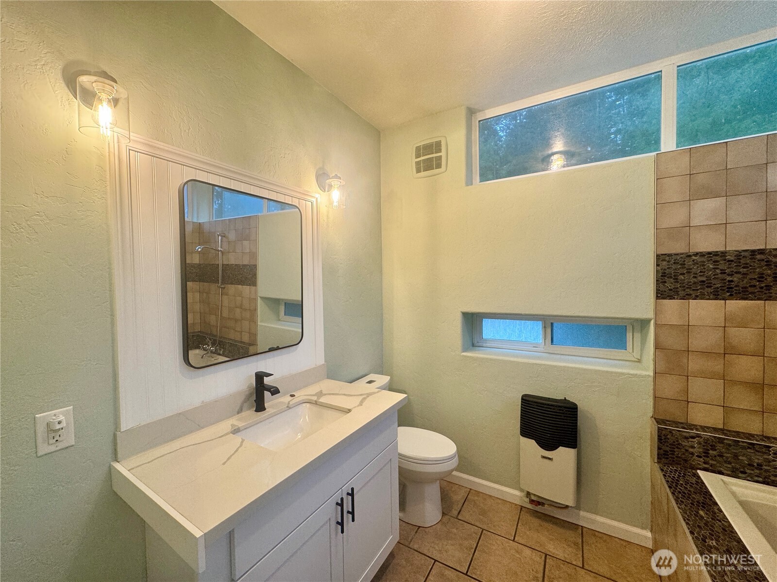 22305 Bald Hill Road Southeast Yelm, WA 98597 - Photo 13 of 39 a bathroom with a sink mirror vanity and toilet