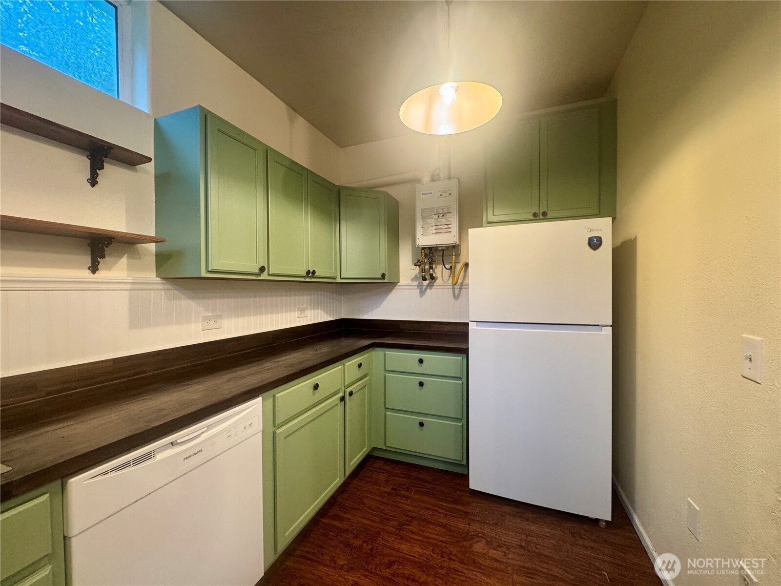 22305 Bald Hill Road Southeast Yelm, WA 98597 - Photo 16 of 39 a kitchen with a refrigerator and a sink