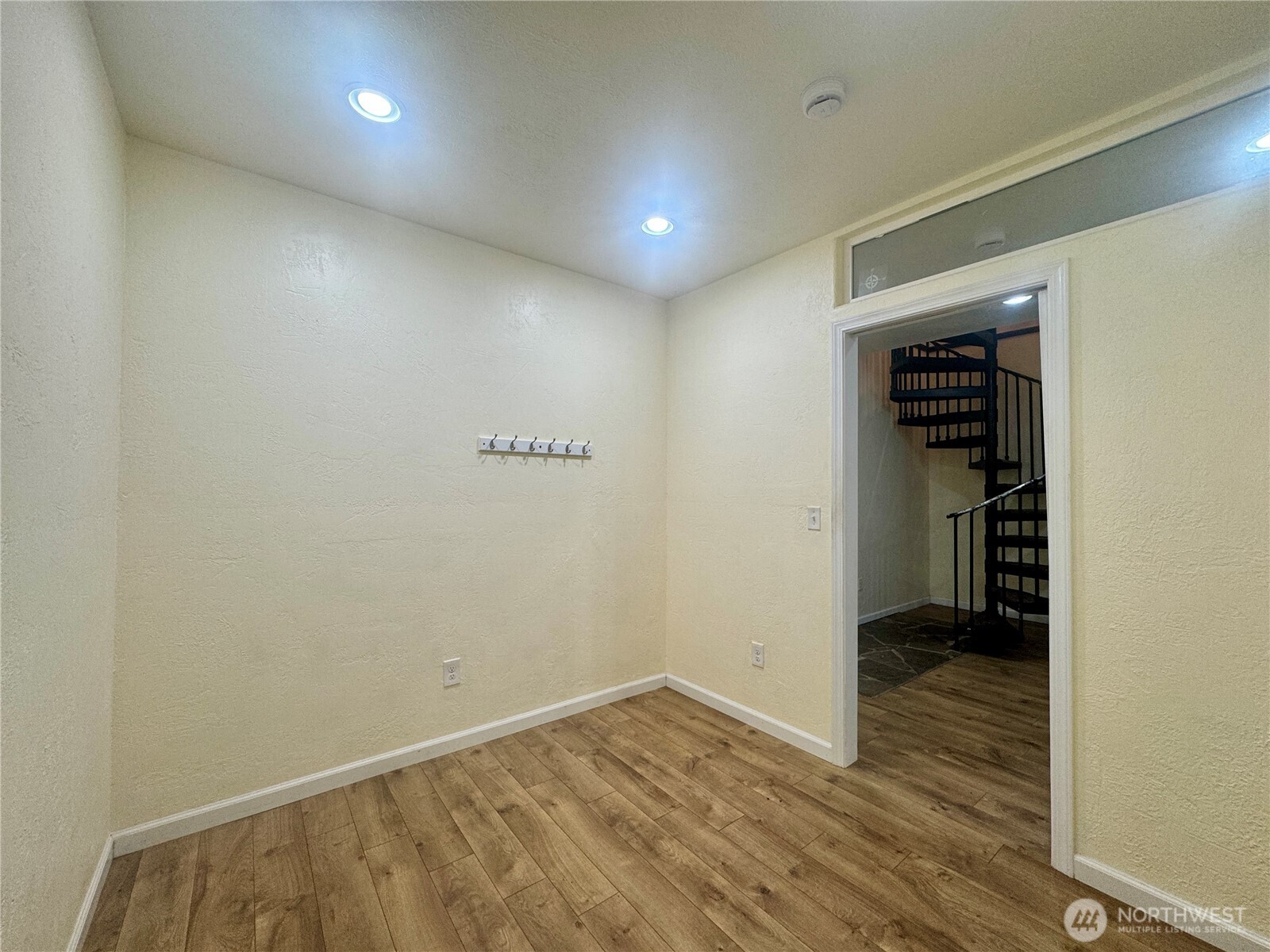22305 Bald Hill Road Southeast Yelm, WA 98597 - Photo 22 of 39 a view of an empty room with wooden floor