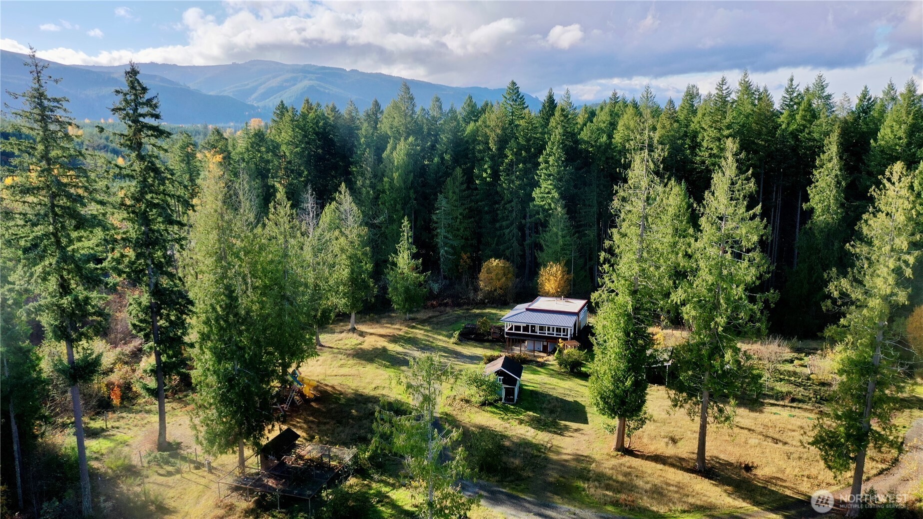 22305 Bald Hill Road Southeast Yelm, WA 98597 - Photo 35 of 39 a view of a backyard with sitting area