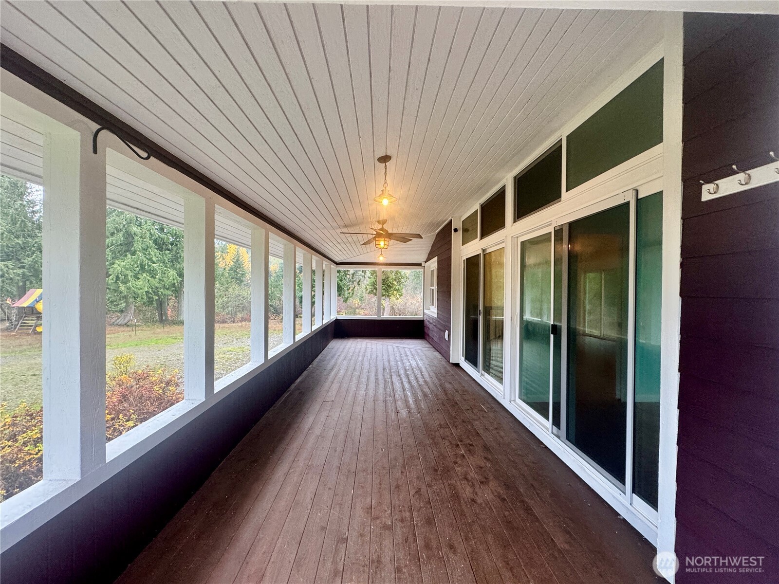 22305 Bald Hill Road Southeast Yelm, WA 98597 - Photo 5 of 39 a view of a porch with wooden floor and iron stairs