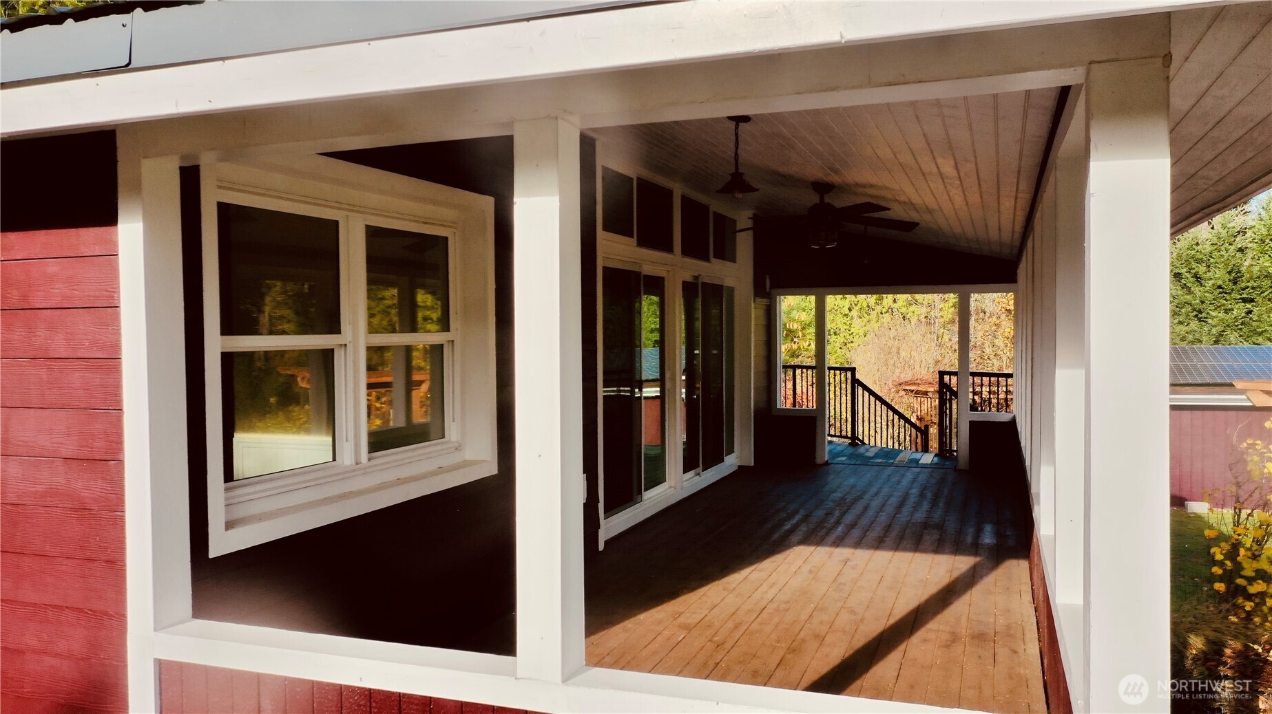 22305 Bald Hill Road Southeast Yelm, WA 98597 - Photo 6 of 39 a view of a porch with wooden floor and windows