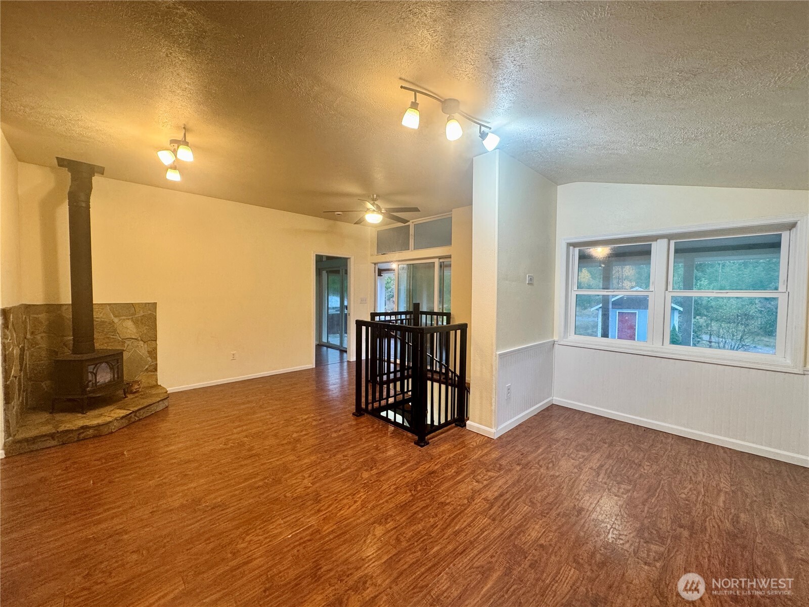 22305 Bald Hill Road Southeast Yelm, WA 98597 - Photo 7 of 39 an empty room with wooden floor and entrance door