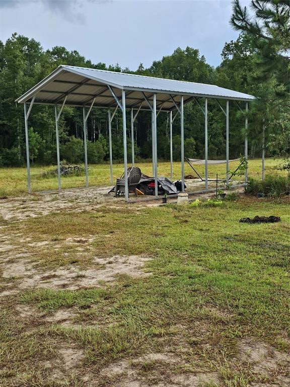 54452 Wildlife Way Callahan, FL 32011 - Photo 11 of 13 a view of a house with backyard and porch