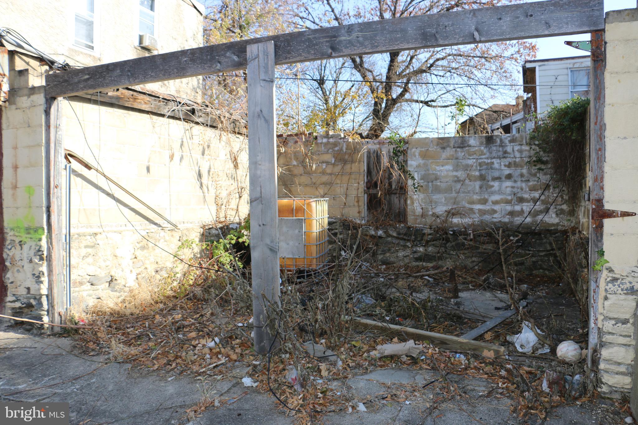 9 North Front Street Darby, PA 19023 - Photo 14 of 19 a glass building with a trees in the background