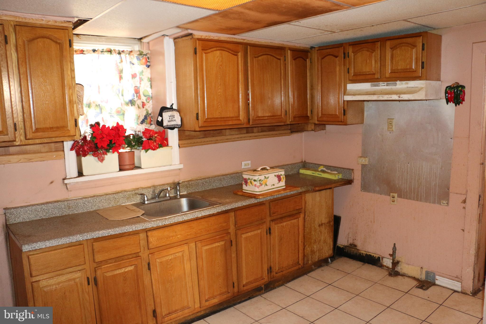 9 North Front Street Darby, PA 19023 - Photo 4 of 19 a bathroom with a sink and a mirror