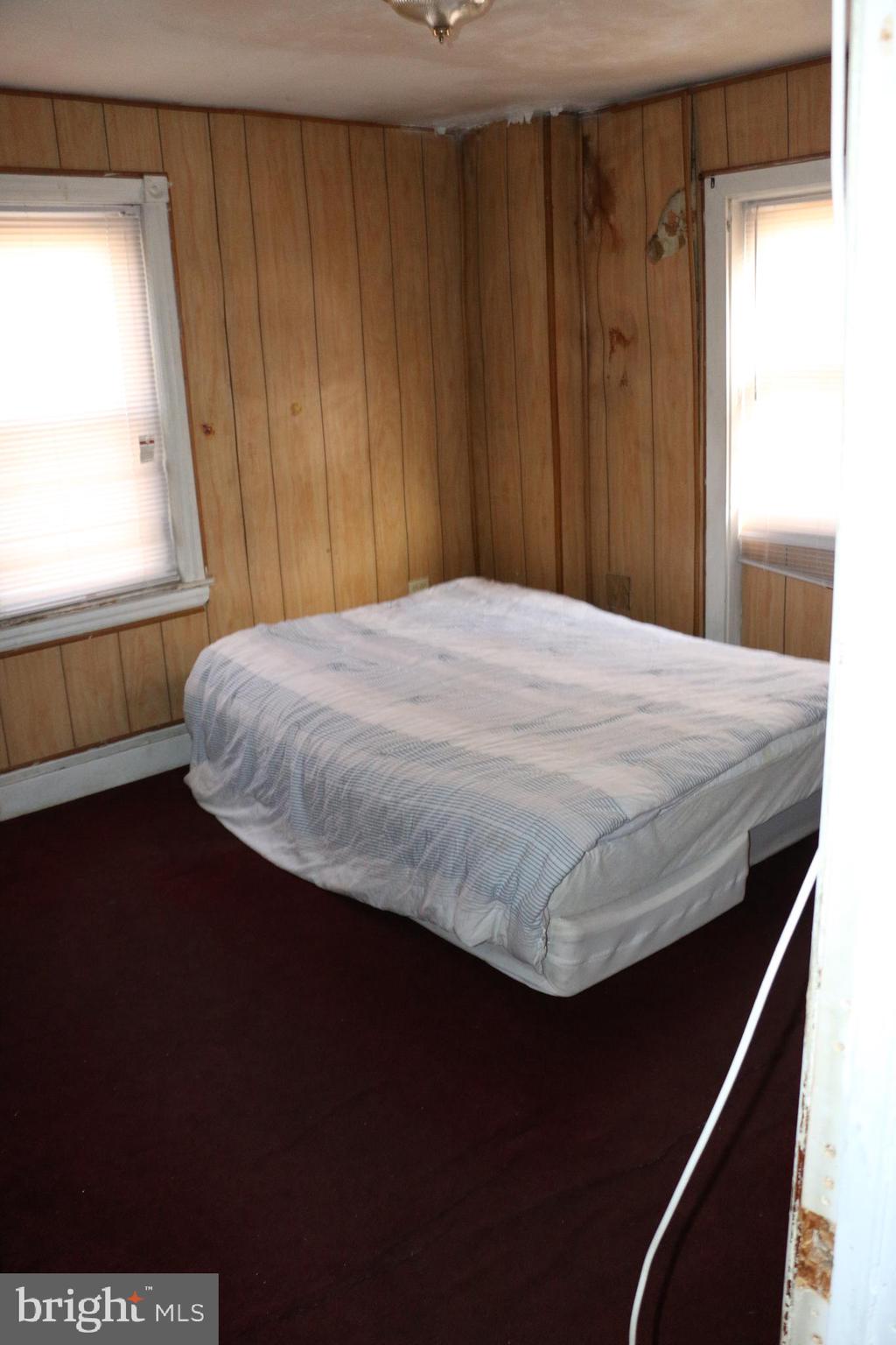 9 North Front Street Darby, PA 19023 - Photo 5 of 19 a bedroom with a bed and a window