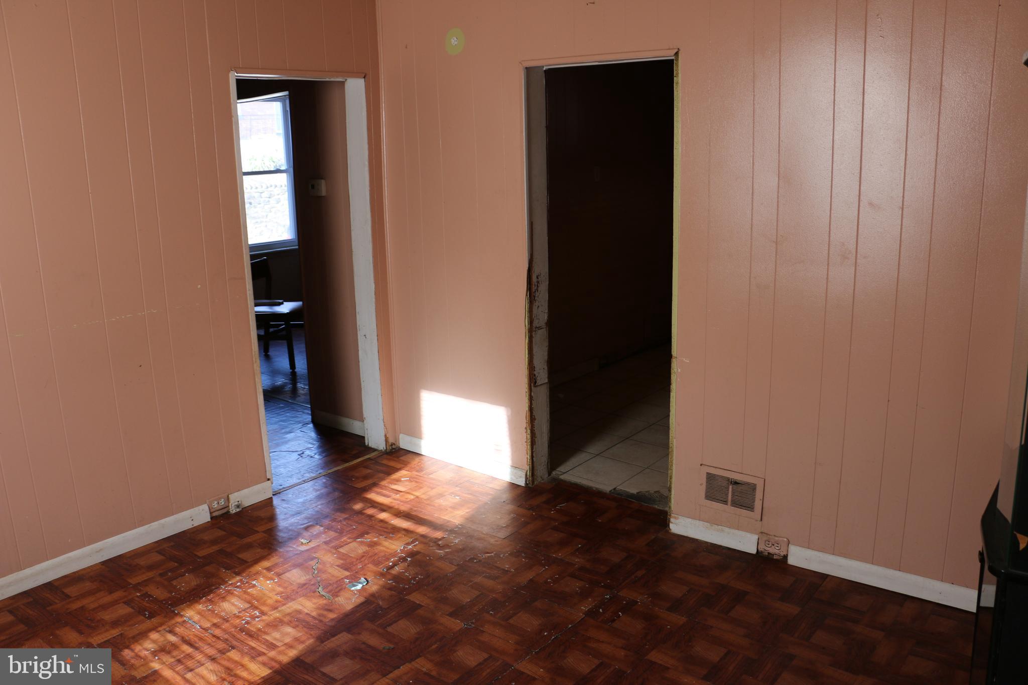 9 North Front Street Darby, PA 19023 - Photo 7 of 19 an empty room with wooden floor and windows
