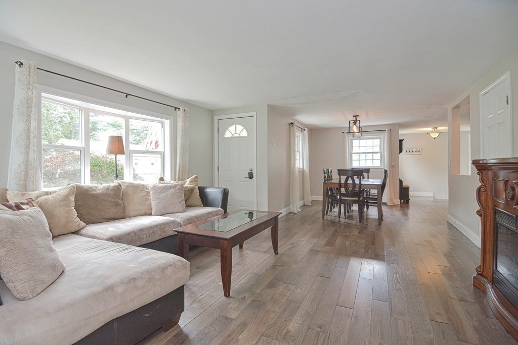 93 Cameron Road Norwood, MA 02062 - Photo 12 of 42 a living room with furniture and a large window