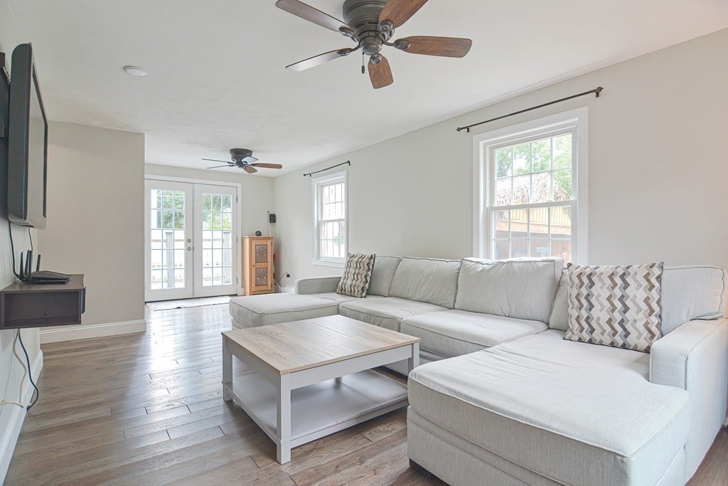93 Cameron Road Norwood, MA 02062 - Photo 15 of 42 a living room with furniture and a flat screen tv