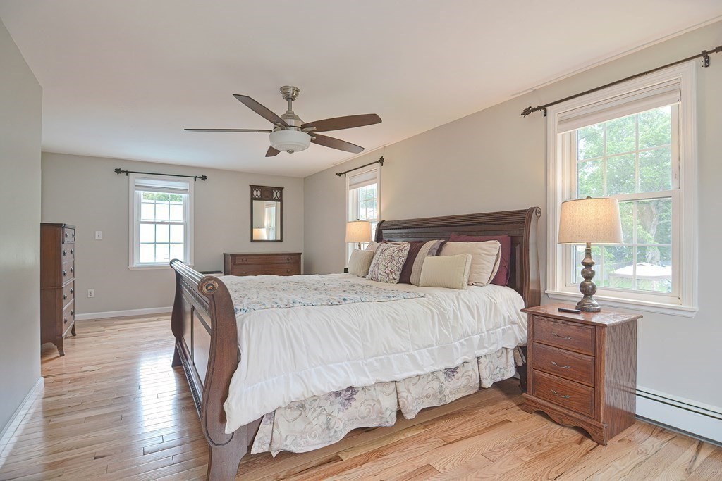 93 Cameron Road Norwood, MA 02062 - Photo 24 of 42 a bedroom with a bed and wooden floor