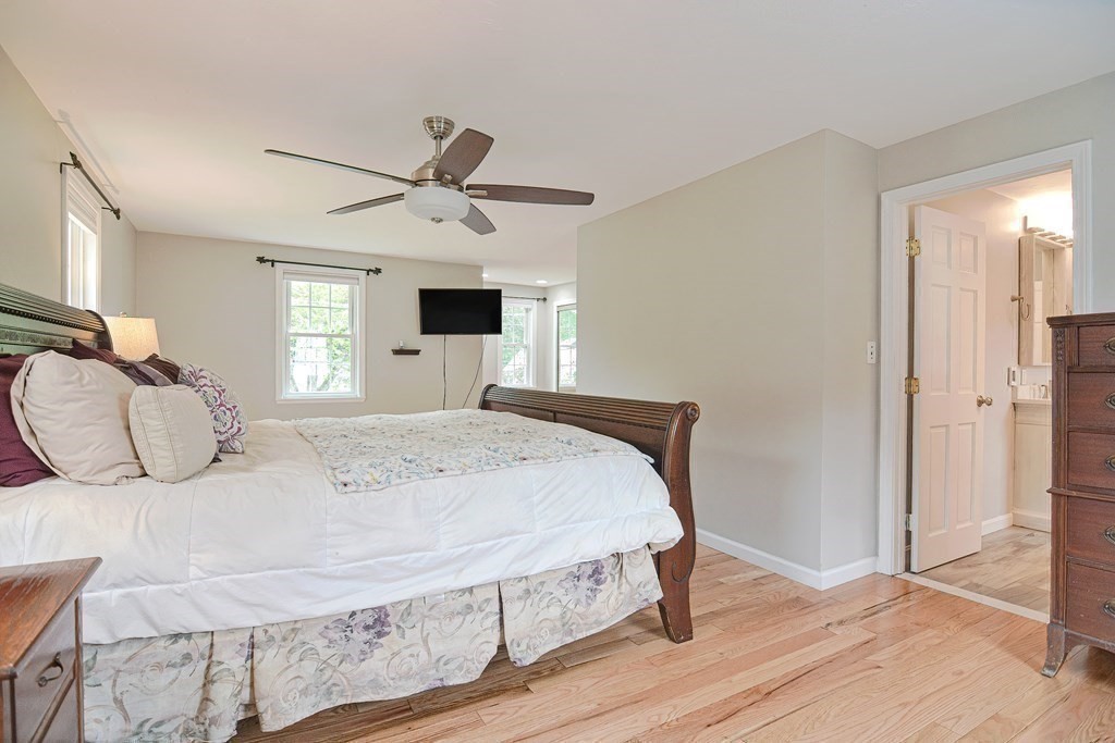 93 Cameron Road Norwood, MA 02062 - Photo 25 of 42 a bedroom with a bed and wooden floor