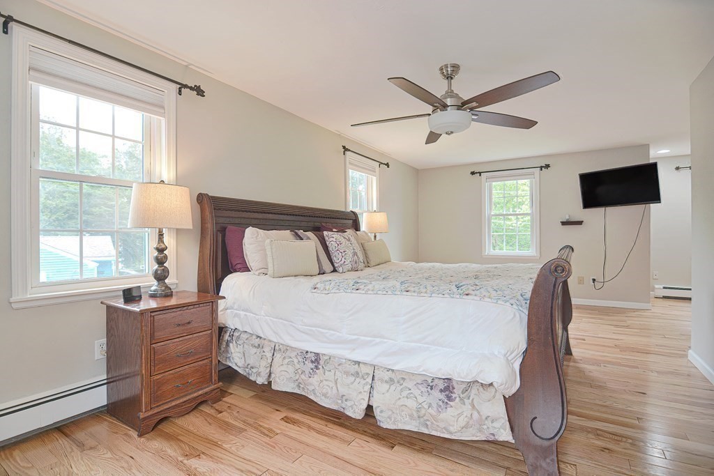 93 Cameron Road Norwood, MA 02062 - Photo 26 of 42 a bedroom with a bed and a flat screen tv