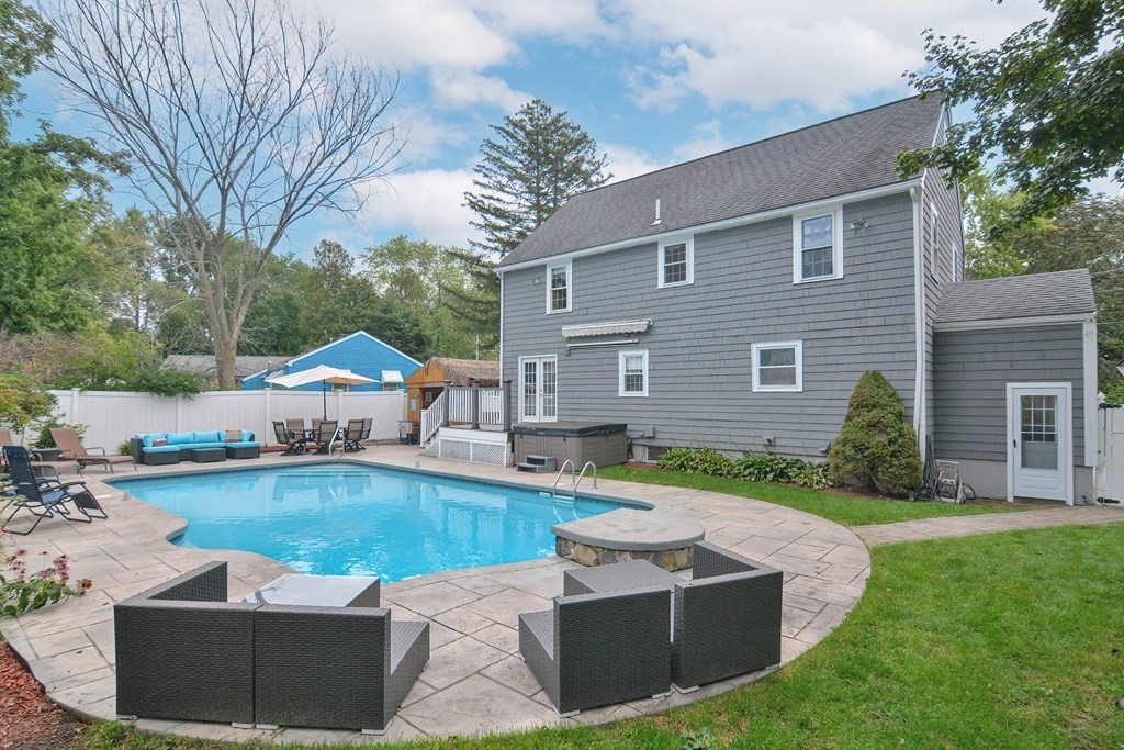 93 Cameron Road Norwood, MA 02062 - Photo 35 of 42 a front view of a house with garden and swimming pool