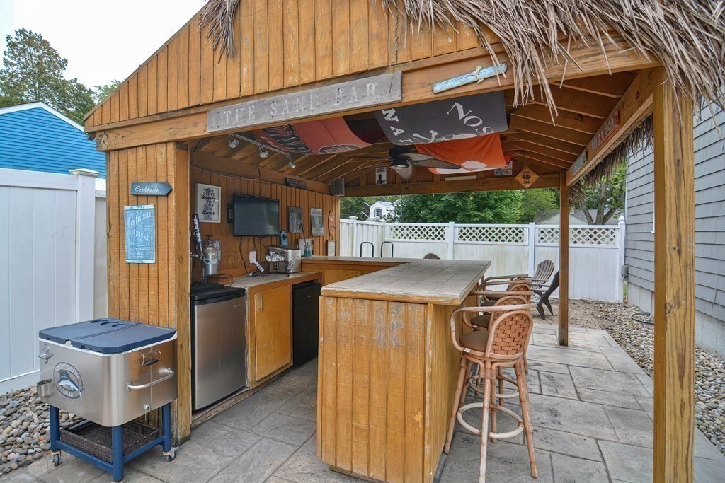 93 Cameron Road Norwood, MA 02062 - Photo 39 of 42 a view of a patio with table and chairs