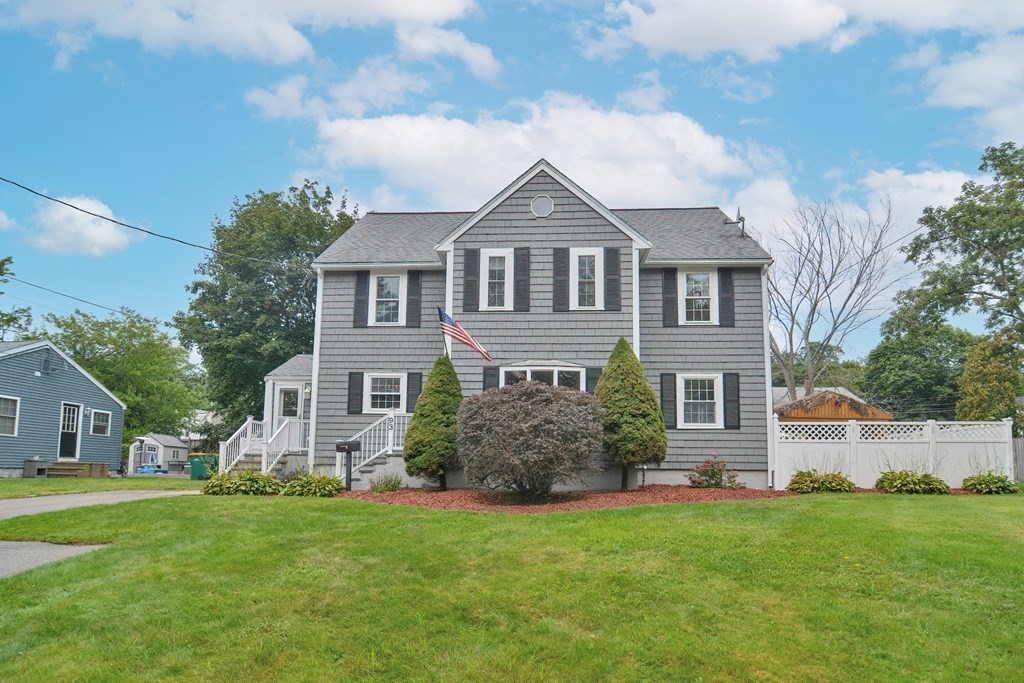 93 Cameron Road Norwood, MA 02062 - Photo 40 of 42 a front view of a house with a garden