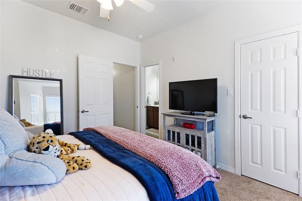 1198 Jones-Butler Road, Unit MULTI College Station, TX 77840 - Photo 28 of 36 a bedroom with a bed and a flat screen tv