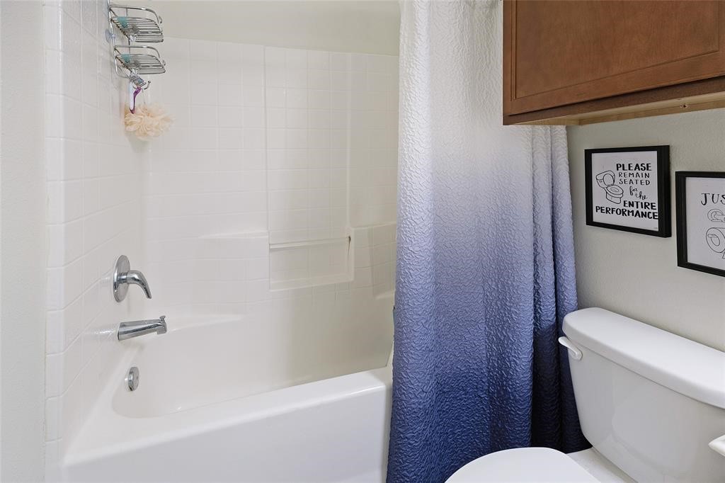 1198 Jones-Butler Road, Unit MULTI College Station, TX 77840 - Photo 30 of 36 a white toilet sitting next to a bath tub