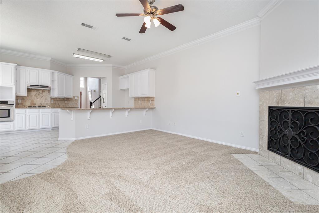 906 Beau Drive Coppell, TX 75019 - Photo 11 of 35 a view of a kitchen with a sink and cabinets