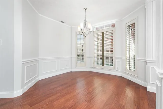 a view of entryway with wooden floor and stairs