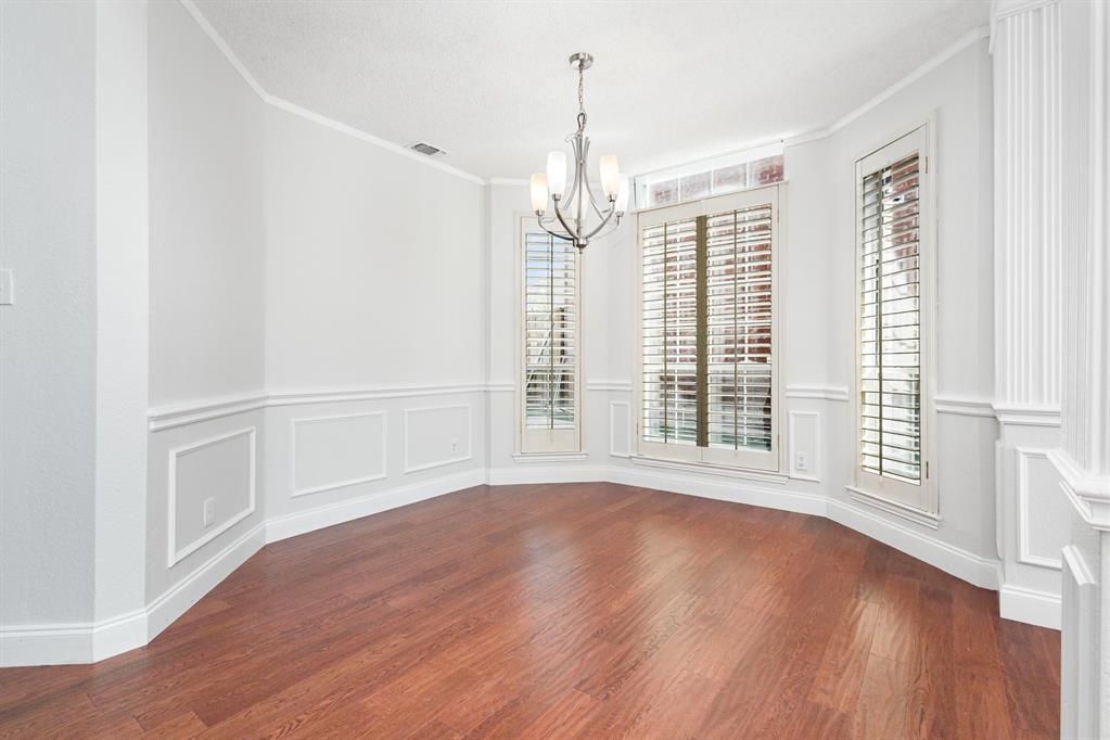 906 Beau Drive Coppell, TX 75019 - Photo 14 of 35 a view of livingroom with hardwood floor and window
