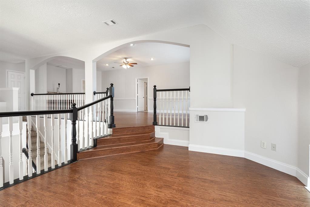 906 Beau Drive Coppell, TX 75019 - Photo 18 of 35 a view of a hallway with stairs