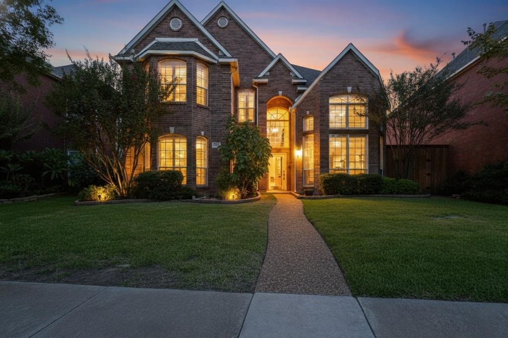 906 Beau Drive Coppell, TX 75019 - Photo 2 of 35 a front view of a house with a yard