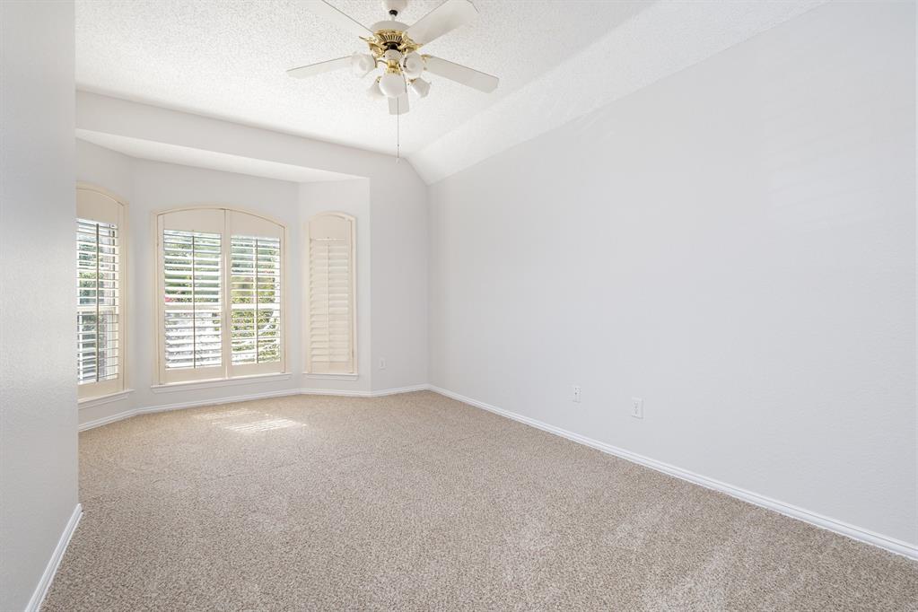 906 Beau Drive Coppell, TX 75019 - Photo 25 of 35 a view of an empty room with a window