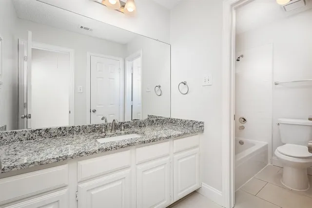 a view of a house with a swimming pool and a porch