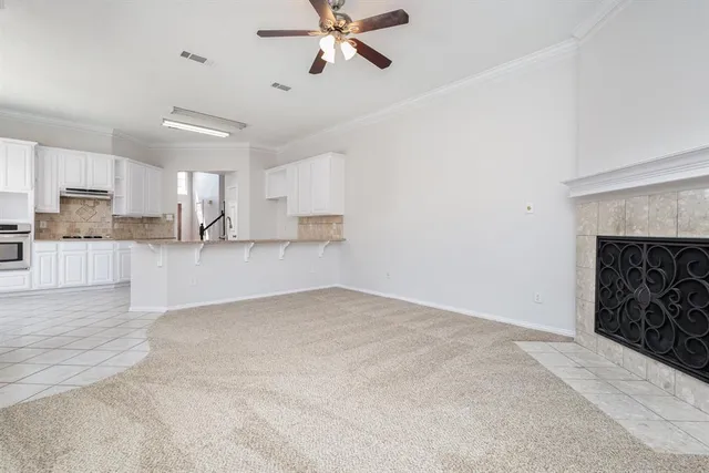 wooden floor in a hall with an entryway and a window