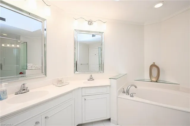 a bathroom with a sink double vanity and a mirror