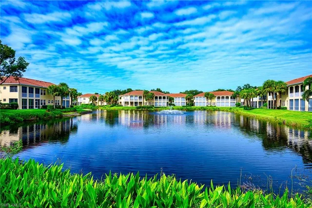 a view of a lake with a building in the background