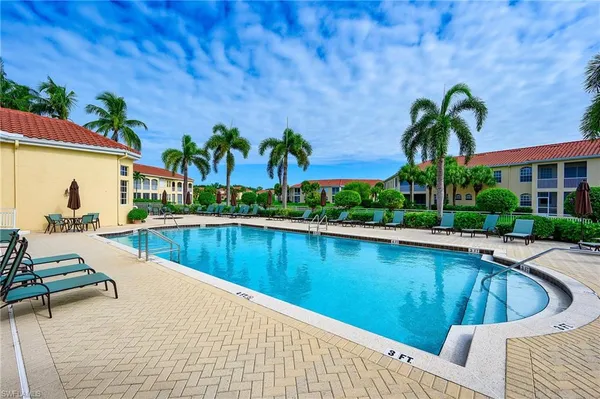 a view of a swimming pool with a patio