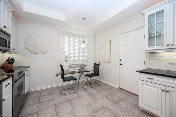 a kitchen with sink cabinets and window