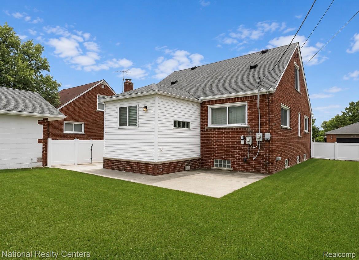 7285 Helen Street Center Line, MI 48015 - Photo 28 of 32 Expansive green lawn with a concrete patio