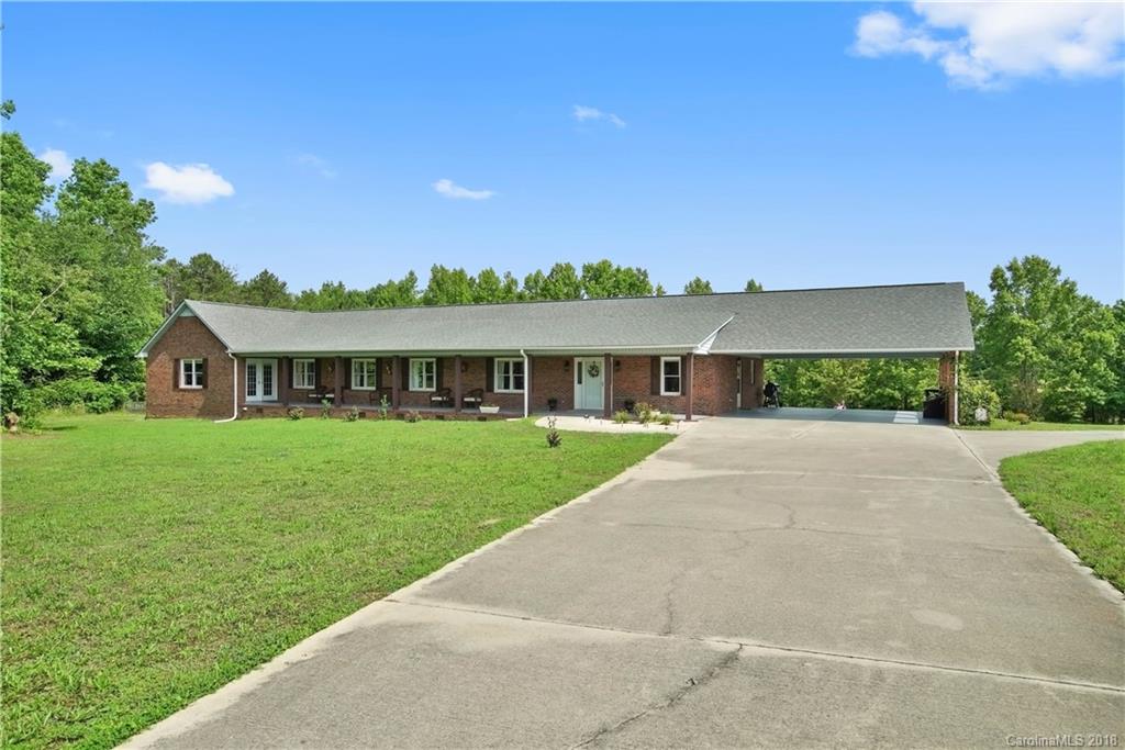 1948 Kadena Lane York, SC 29745 - Photo 2 of 25 a front view of a house with a yard and garage