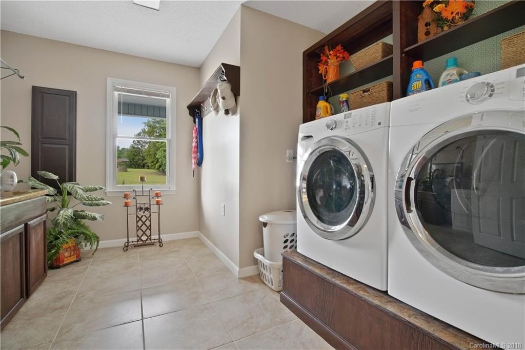 1948 Kadena Lane York, SC 29745 - Photo 12 of 25 a utility room with sink dryer and washer