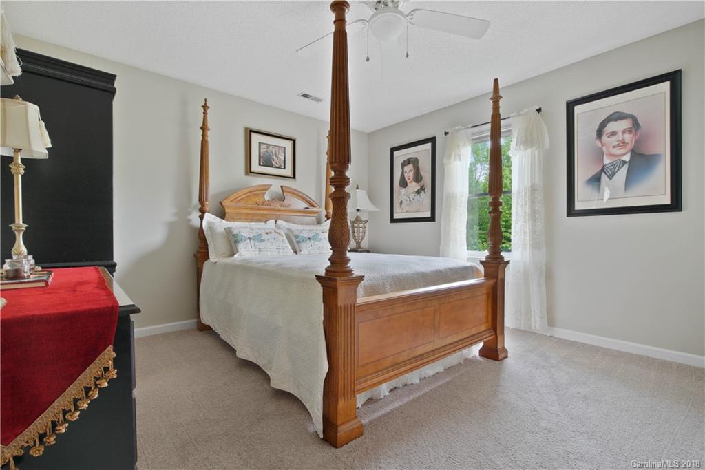 1948 Kadena Lane York, SC 29745 - Photo 16 of 25 a bed room with a bed and a painting on the wall
