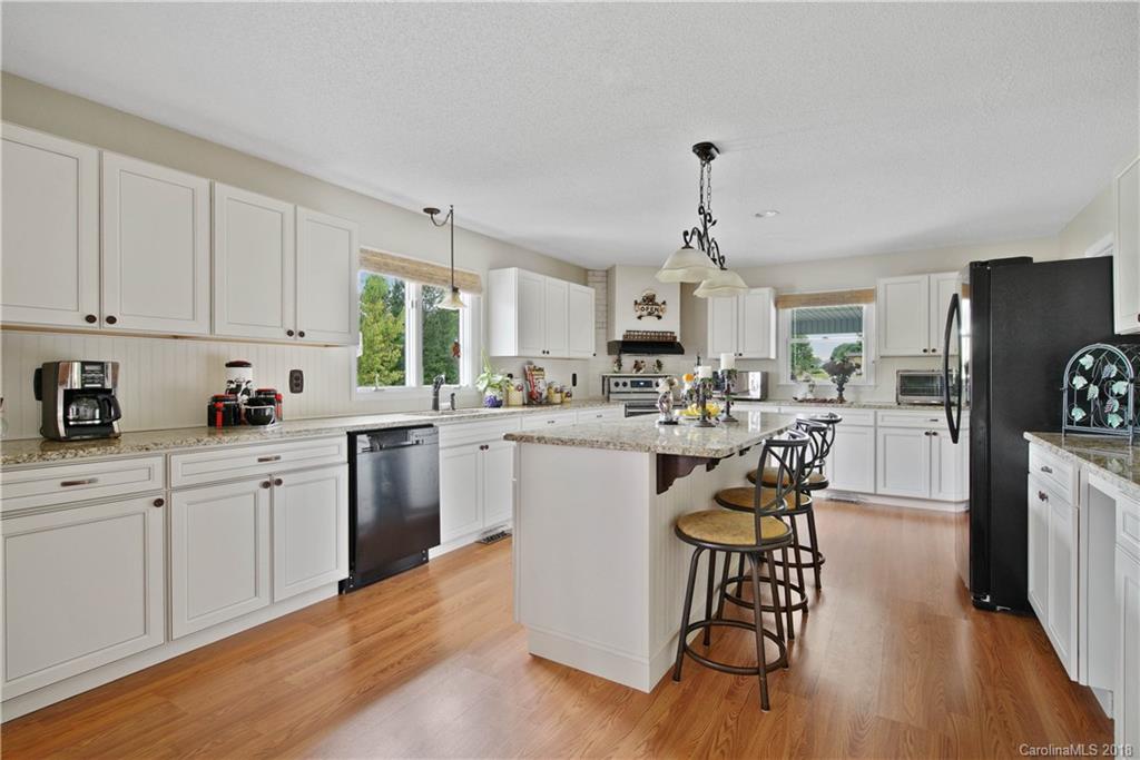 1948 Kadena Lane York, SC 29745 - Photo 10 of 25 a kitchen with white cabinets and stainless steel appliances