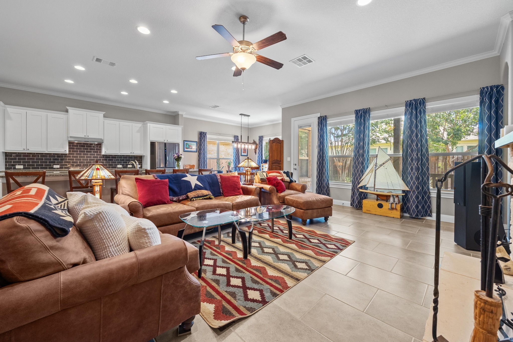 2114 Manada Trail Leander, TX 78641 - Photo 12 of 36 a living room with furniture kitchen view and a large window