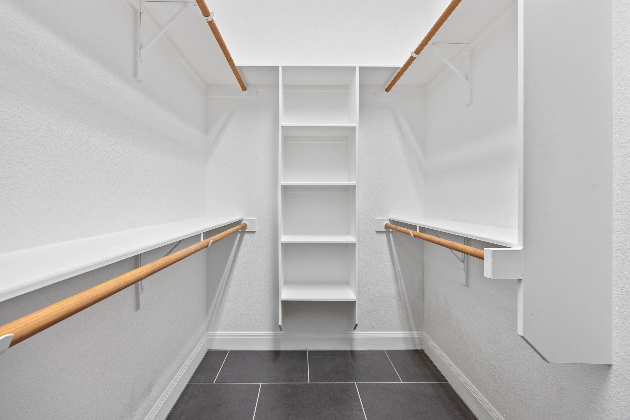 2114 Manada Trail Cedar Park, TX 78641 - Photo 14 of 36 a view of walk in closet with empty racks