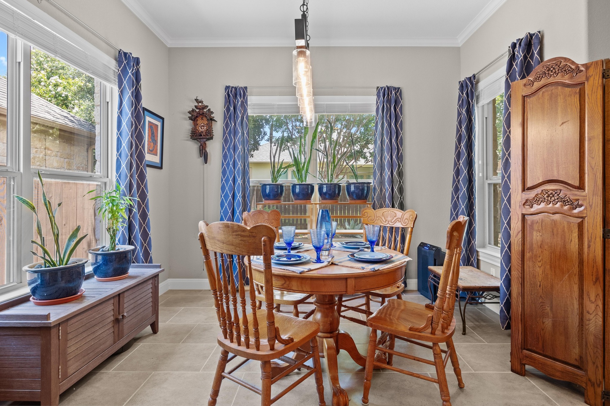 2114 Manada Trail Leander, TX 78641 - Photo 17 of 36 a dining room with furniture a window and a chandelier