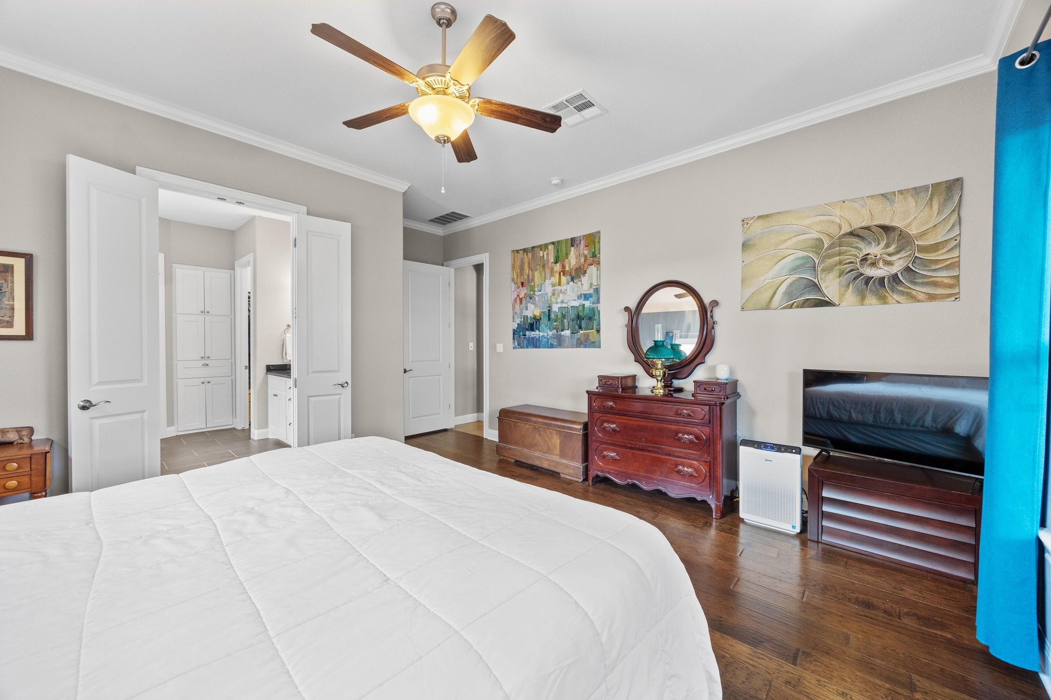 2114 Manada Trail Leander, TX 78641 - Photo 19 of 36 a bedroom with a bed and a chandelier